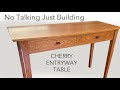 Entryway Table with Continuous Wood Grain Drawer Fronts