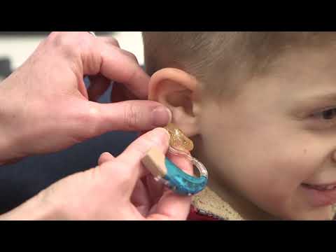 How To Insert An Earmold And Hearing Aid In A Child's Ear