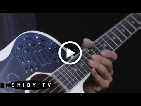 Musician playing the worlds first Wireless MIDI Controller for Acoustic Guitar