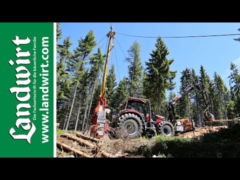 Tractor with cable crane and processor | landwirt.com