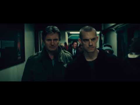 Run All Night trailer still — Jimmy Conlon lit by neon as sirens and low brass simmer