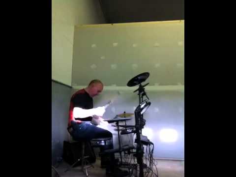 Slick playing drums