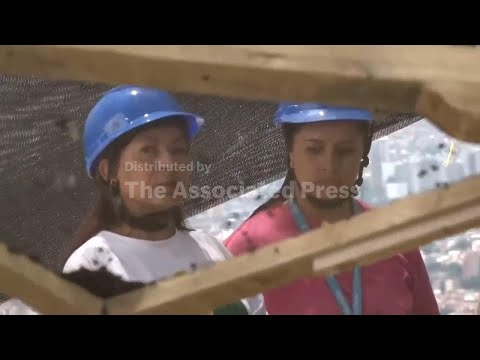 Relatives of Colombia's disappeared watch workers sifting through soil, searching for bones