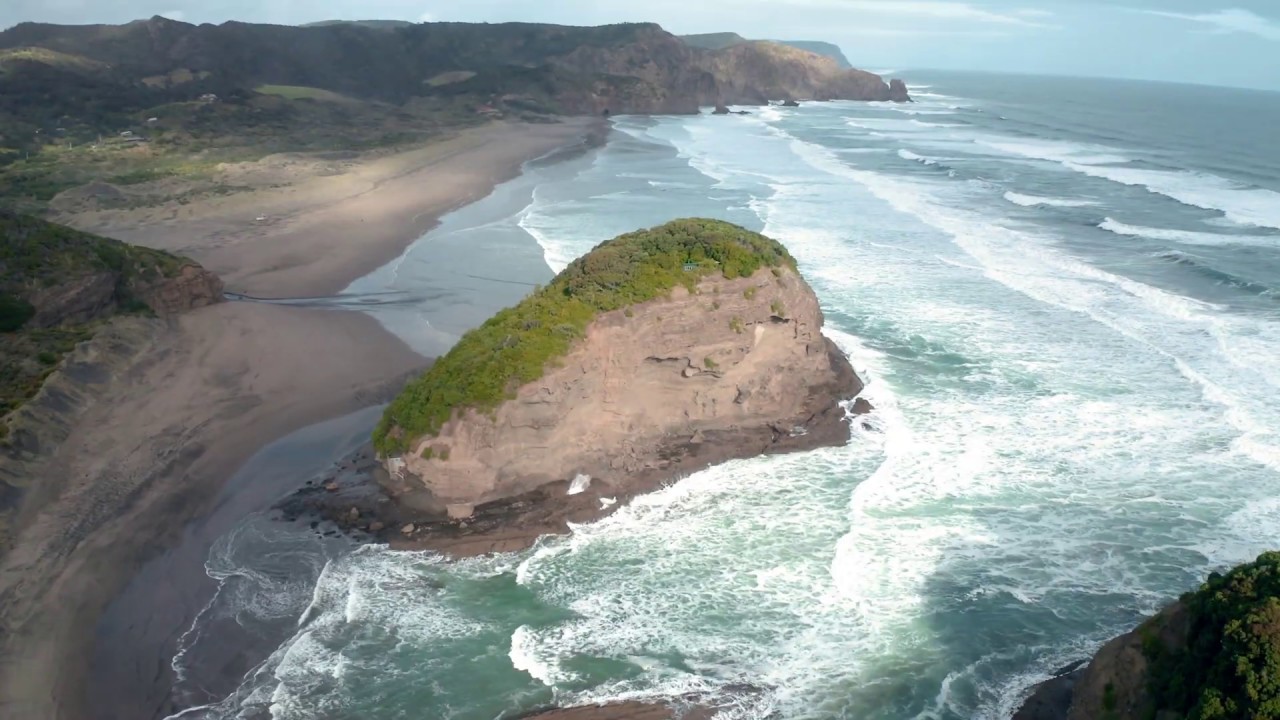 Experience the rugged beauty of Bethells Beach