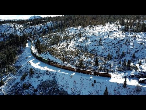 4K- Scenic Snowy Donner Pass: Drone Chase of a UP Freight Train at Yuba Gap & Emigrant Gap, CA