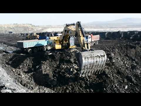 Caterpillar 385B Excavator Loading Trucks With Two Passes