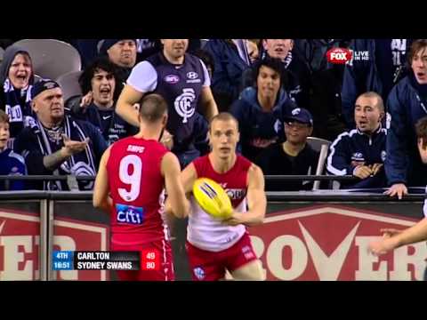 Ted Richards retrieves the ball from the Carlton cheersquad