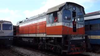 Loco 38235 pulling a bulk sugar train through Santa Clara Railcar 2216 at the Station