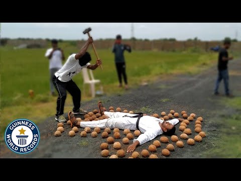 Most coconuts smashed around a person whilst blindfolded - Guinness World Records