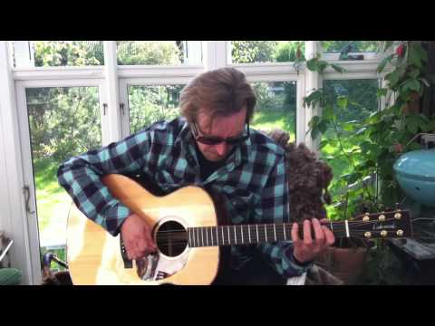 Per Møller at home singing, playing