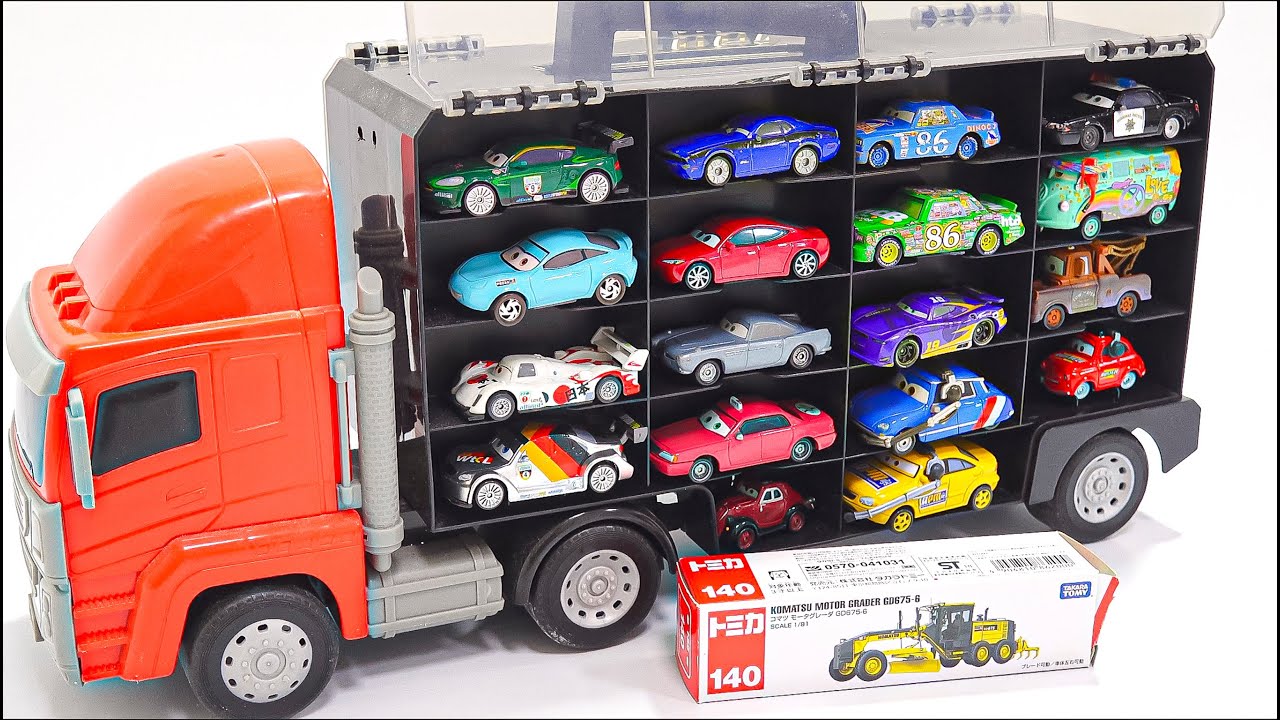 The car characters from the movie appear in a red HUGE truck. Let's all take a look.