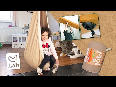 Fixation pas à pas du nid-hamac pour enfants JOKI à une poutre en bois