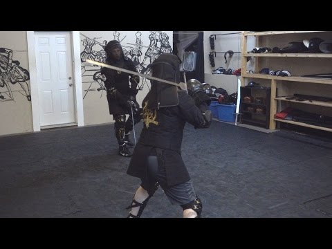 Steel longsword / synthetic saber sparring: Chris vs. Lianna