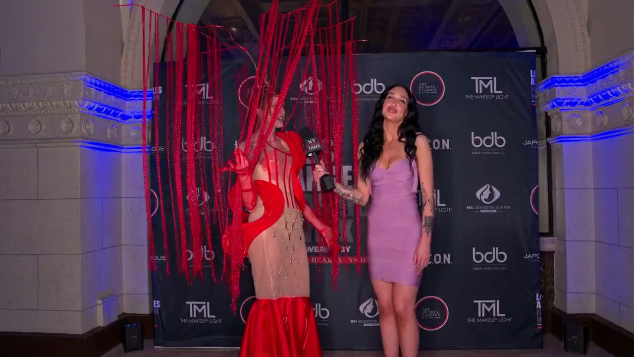 Ava Cherlyn interviews Model Kiki wearing unusual artistic dress at ArtHeartsFashion LAFW