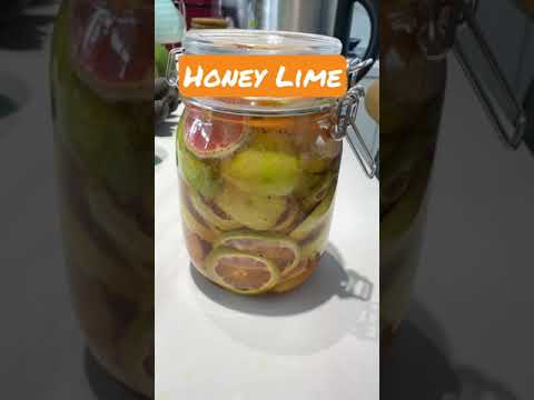 Lime soaked in honey making a healthy drink after a month to treat coughs, cold and stomach upset