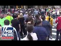 Crowds gather outside Trump Tower as former president decries conviction