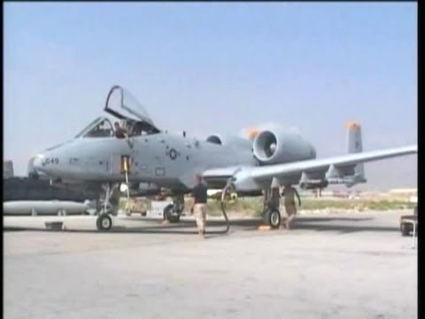 Airmen arming an A-10 Warthog for a sortie in Afghanistan. A-10 taking off, flying by | AiirSource
