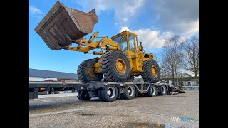 Caterpillar 966C offloading from lowbed