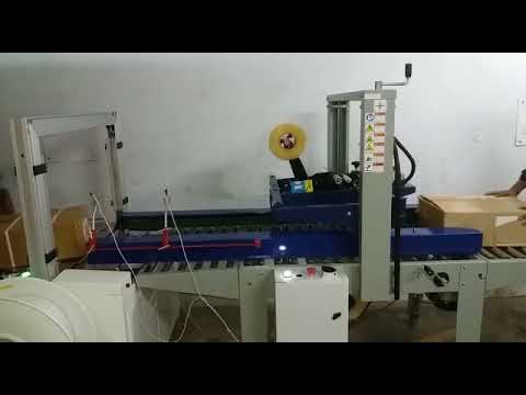 Combo automatic carton sealer & strapping unit