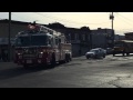 FDNY LADDER 166 CRUISING BY ON STILLWELL AVE IN CONEY ISLAND AREA OF BROOKLYN IN NEW YORK CITY