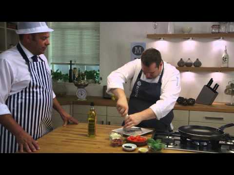 Pan-fried hake with Mediterranean tomatoes recipe | Morrisons