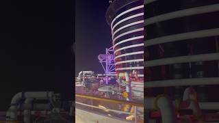 The Disney Fantasy lit up at night 🙃