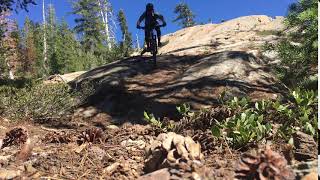 Riding a fun slab feature along Gold Valley Rim Trail.