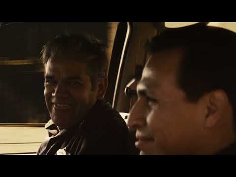 Trailer end-card with border fence and getaway car fragments