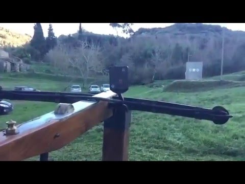 Medieval crossbow shoot in slow-motion with spinning nut