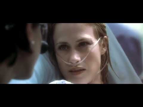 Trailer frame: subway strobe and rain — the score’s pulses sync to the shocks