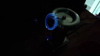 Tesla coil arcing through a xenon flash bulb