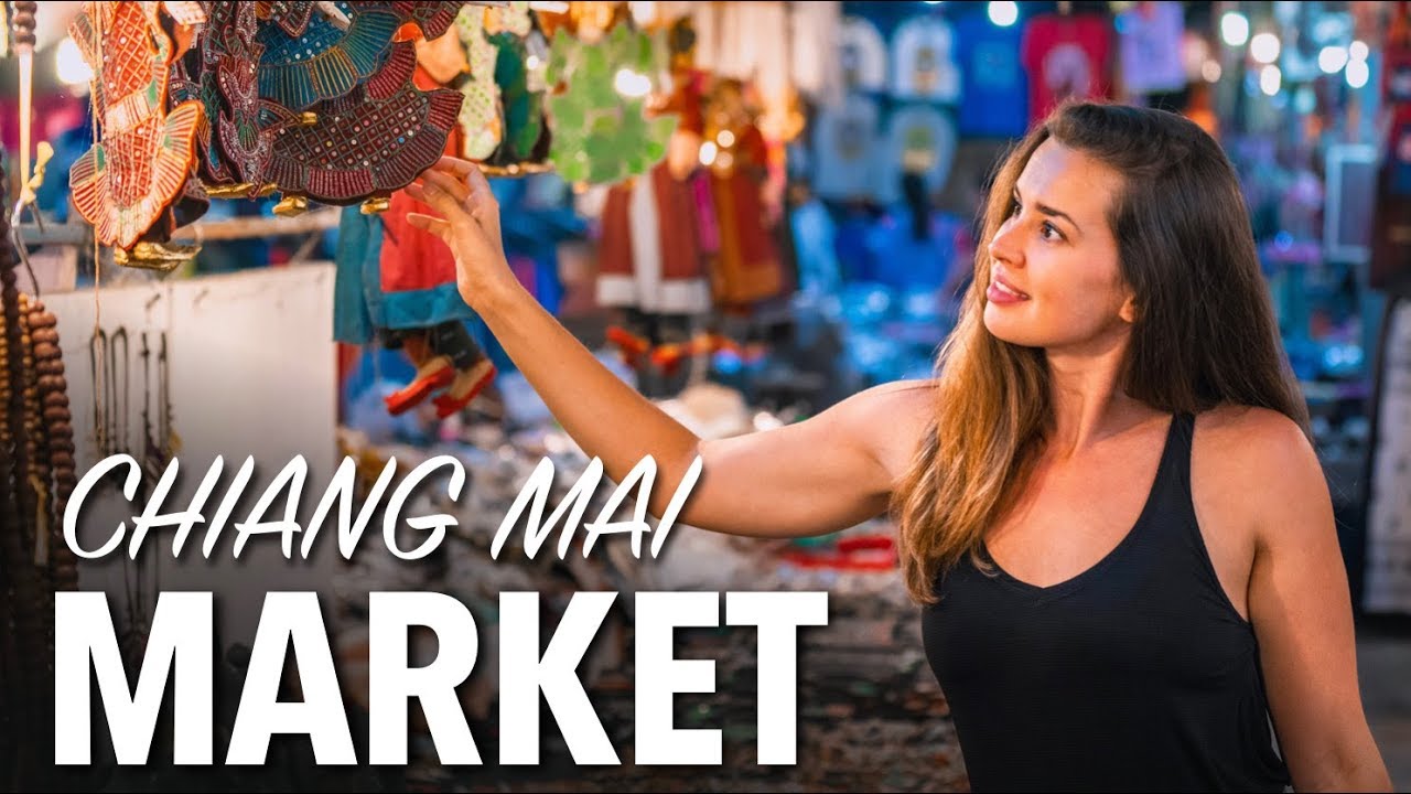 Discover the vibrant Sunday Walking Street Market with tourists exploring it.