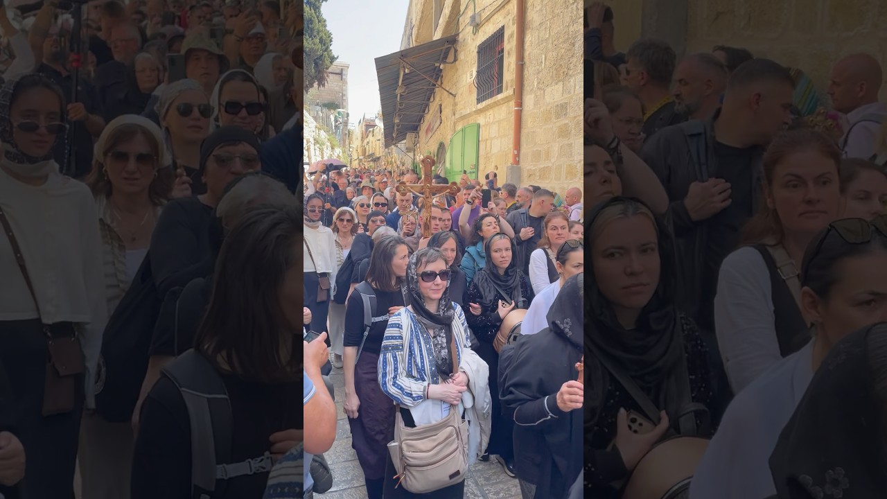 Walking with cross in Via Dolorosa