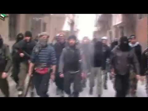 توجه عناصر كتيبة أحفاد سيدنا حمزة للسيطرة على أبنية الإسكان في حي التضامن في دمشق