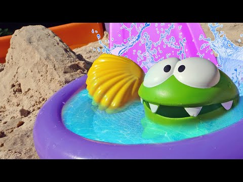 Uima-allas lasten leluille. Hiekkaleikkejä & hiekkaleluja. Vesipuisto Om Nom -hahmolle.