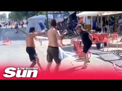 Moment Eintracht thug takes chair to the face as footage shows ultras ambush Rangers fans in Seville