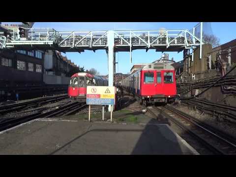 London Underground D Stock 7513 and 7018 + 1973 Stock 879 and 216 at Barons Court