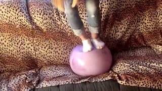 Amanda balancing herself on a ball.