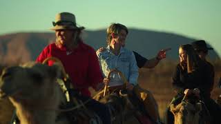 Seek different on a camel ride at Uluru in Australia’s Red Centre.