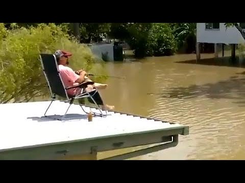 Meanwhile, in Australia they're calmly drinking beer and fishing in floodwaters