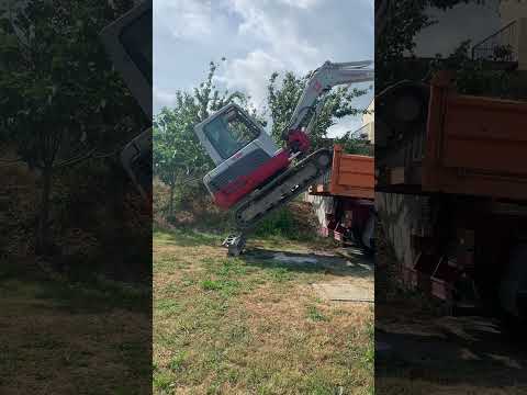 takeuchi excavator TB250 extreme unload from a truck