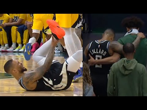 Damian Lillard grabs Achilles after non-contact injury and gets carried to locker room