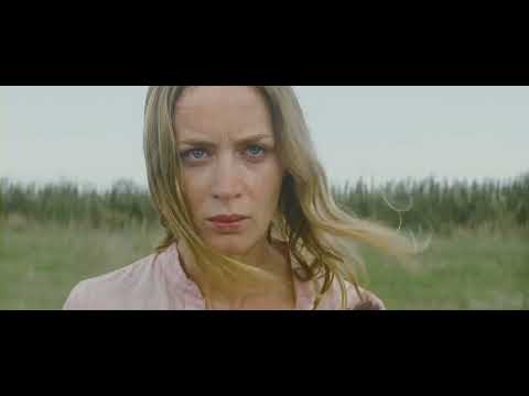 Looper trailer frame showing Bruce Willis and Joseph Gordon-Levitt confronting each other in the diner