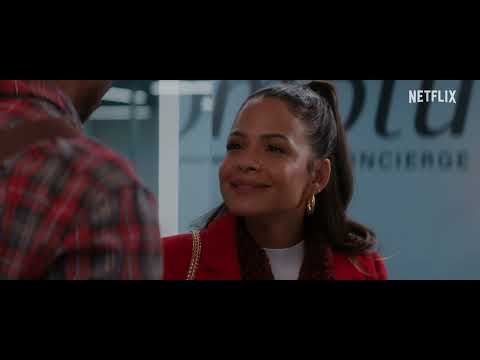 Meet Me Next Christmas still with Christina Milian and Devale Ellis framed by holiday lights