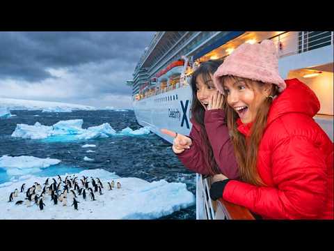 Cassie looking out from a cruise ship at Antarctic ice and penguins