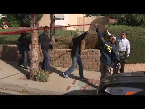 Investigators were seen on Thursday outside the home of California bar shooting suspect Ian David Long. Neighbors described the man who shot and killed 12 people at a country music bar as distant in public but combative with his mother. (Nov. 9)