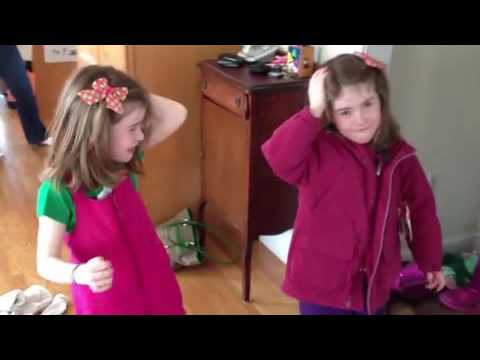 Twin girls bang heads together