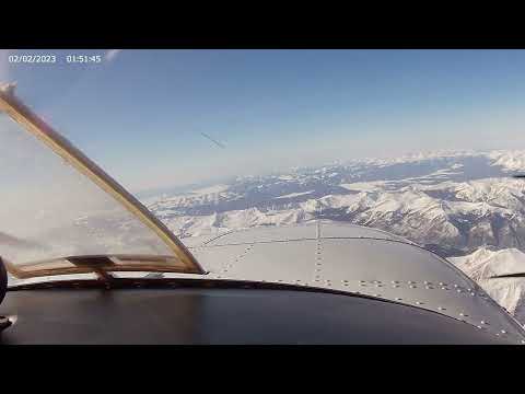 Beechcraft P Baron going over the Rocky Mountains at 20,000 feet