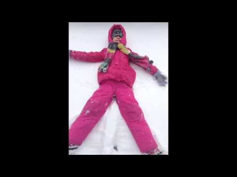 Young Girl Makes Snow Angels