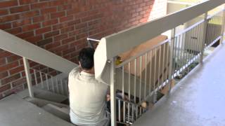 Moving a safe upstairs with a stair climber.